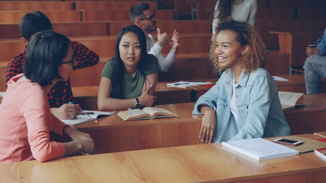 Students talking together after a class.